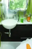 A s,all washbasion and built-in soap dispenser