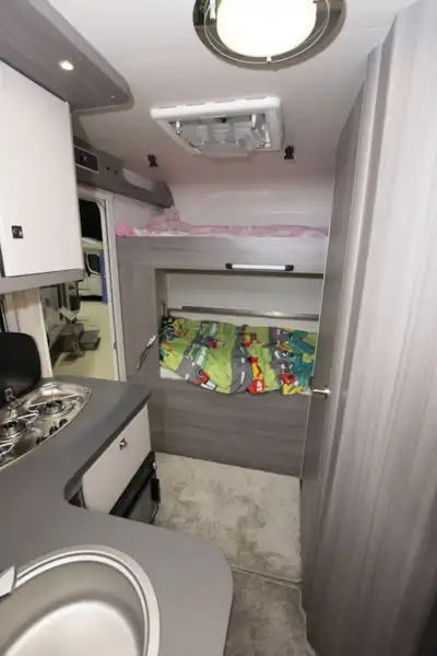 The bedroom in the Hobby Optima OnTour T65 HKM (Click to view full screen)