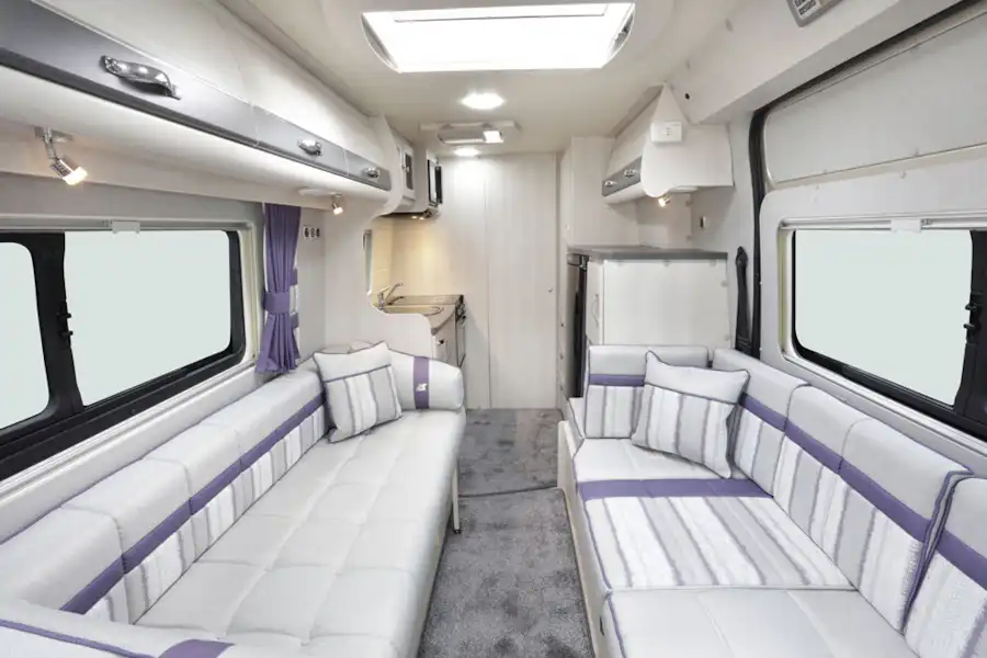 The lounge with bench seating in the Auto-Sleeper Kemerton XL campervan (Click to view full screen)