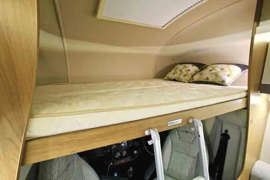 The overcab bed - headroom is good but night-time lighting could be better (Click to view full screen)