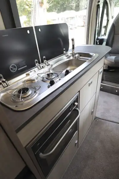The kitchen, with two-burner hob, in the Auto-Trail Adventure 65 campervan (Click to view full screen)