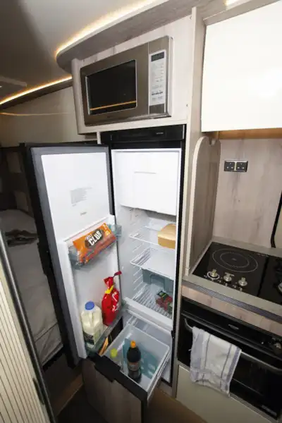 The kitchen, with fridge open, in the WildAx Elara campervan (Click to view full screen)