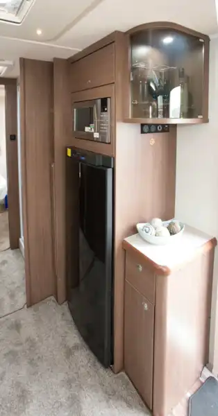 A drinks cabinet alongside the tower fridge freezer (Click to view full screen)