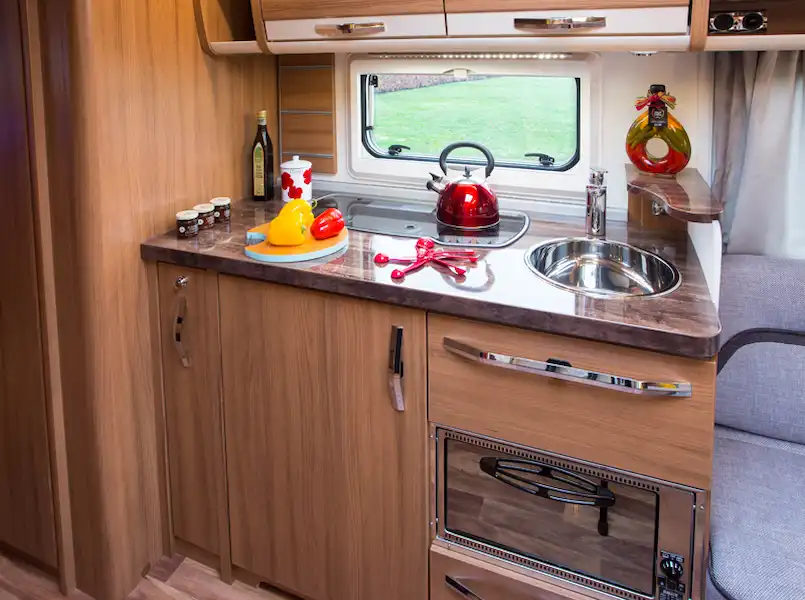 The 590 has a three-burner hob and a combined oven-grill (Click to view full screen)
