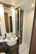 The washroom includes a separate shower