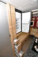 The fridge, opposite the galley kitchen