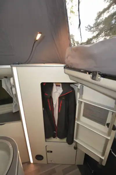 Wardrobe storage in the Ford Nugget  (Click to view full screen)