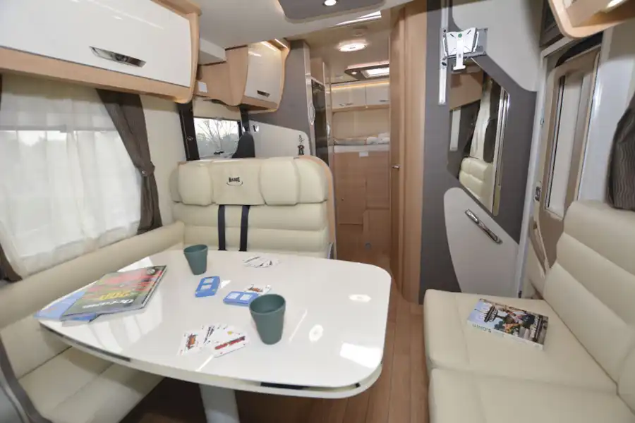 View of the lounge and dining table in the McLouis Fusion 360 motorhome (Click to view full screen)