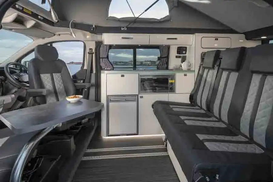 The seating area, with sofa and chairs - picture courtesy of Lunar Campers (Click to view full screen)