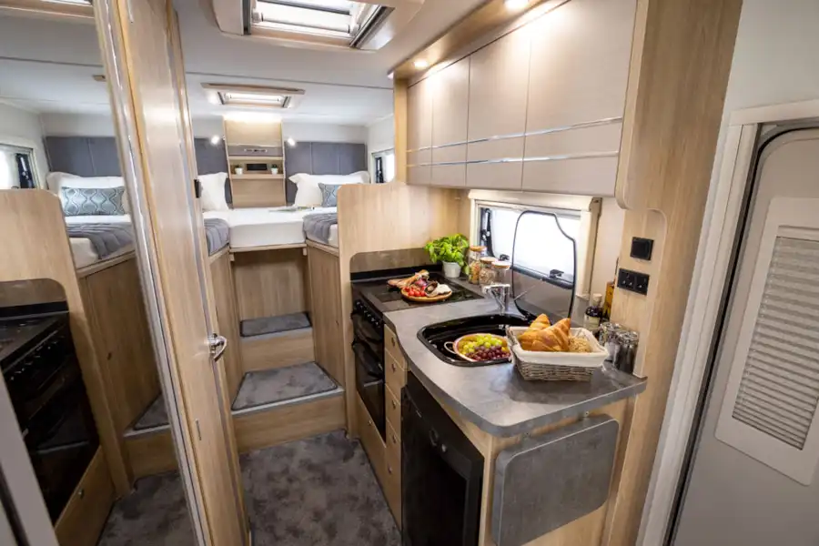 Showing the kitchen and bedroom in the Elddis Autoquest 194 motorhome (Click to view full screen)