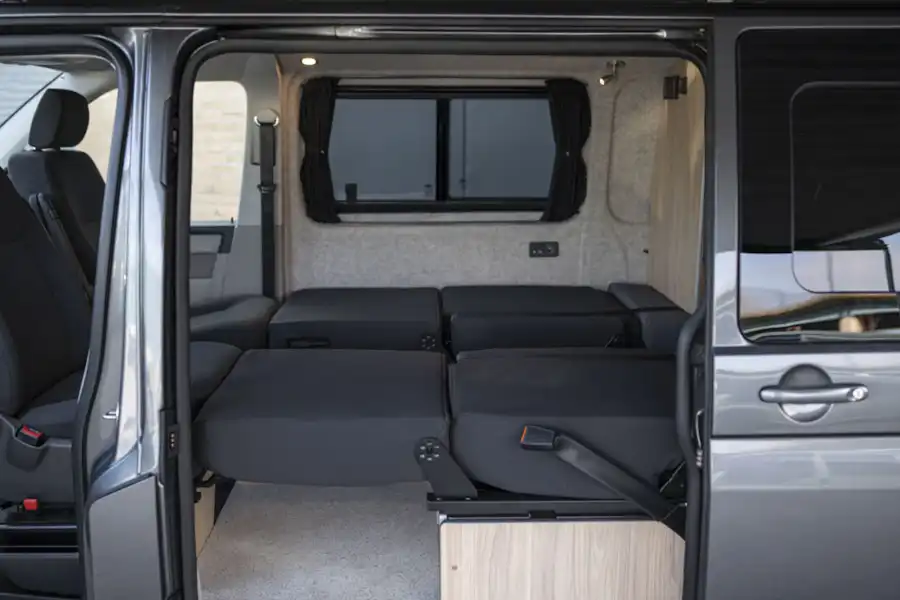 Seating folded down in the Volkspec Leisure Delphi campervan (Click to view full screen)