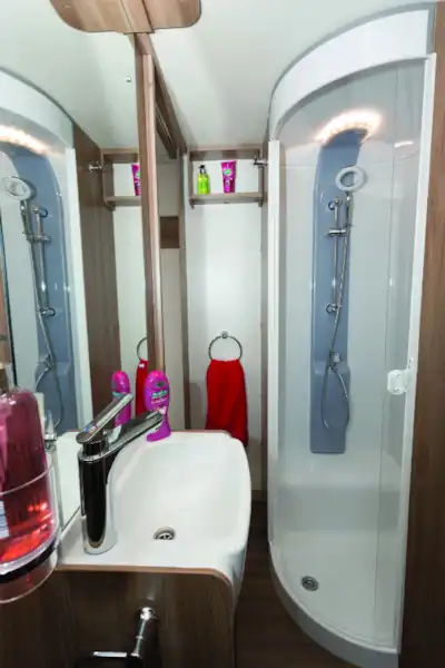 The shower is on the nearside, with towel hooks and a loop nearby (Click to view full screen)
