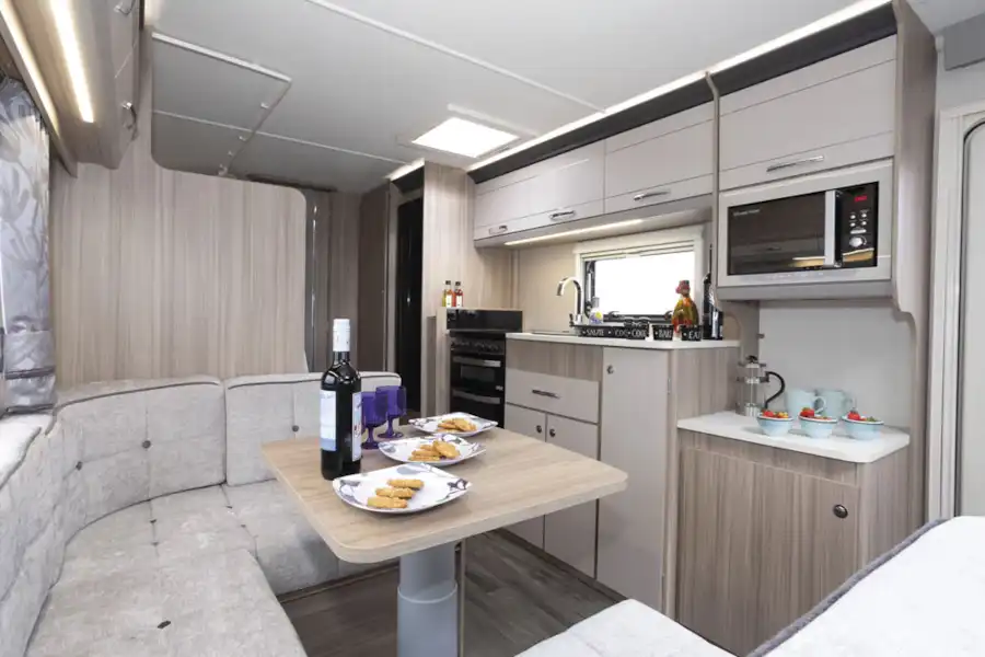 The dining area, near the kitchen, in the Coachman Acadia Xcel 830 caravan (Click to view full screen)