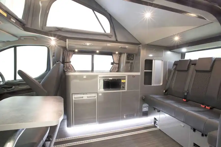 Summit campervan has a rear bench seat on rails and a typical side kitchen layout (Click to view full screen)