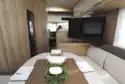 A view of the lounge, with the TV on display, in the Eura Mobil Integra Line 650 HS motorhome