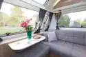 The coffee table hinged at the front of the caravan is 76cm wide and 35cm deep