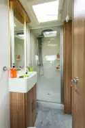 A rear washroom with a large shower cubicle