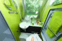 Lime green side walls in the washroom