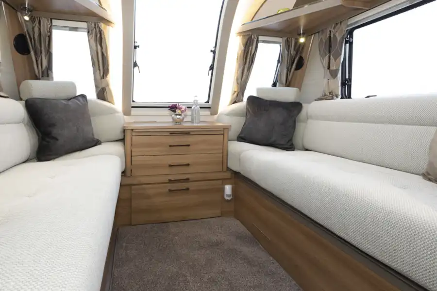 Comfortable settees in the living area in the Bailey Alicanto Grande Faro caravan (Click to view full screen)