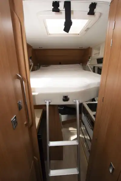 The drop-down bed at the front of the Dreamer Living Van campervan (Click to view full screen)