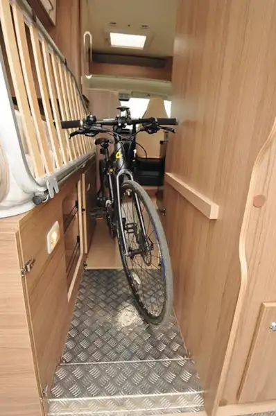 With the bed folded up, you can easily carry a bike (Click to view full screen)