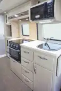 The kitchen includes microwave, oven and grill - picture courtesy of Auto-Sleepers