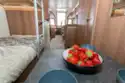 A dining table for children next to the bunks