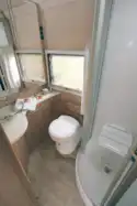 The washroom includes a shower stool