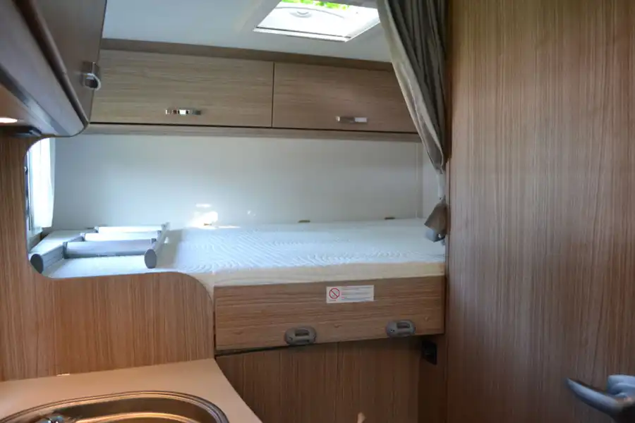 The transverse double bed in the Carado V132 motorhome (Click to view full screen)