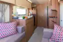 A caravan of two halves, with a bedroom and washroom at the rear.