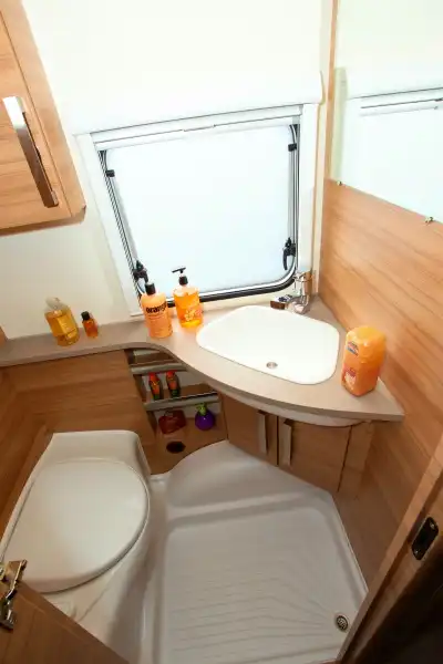 The shower shares the little room with the loo (Click to view full screen)