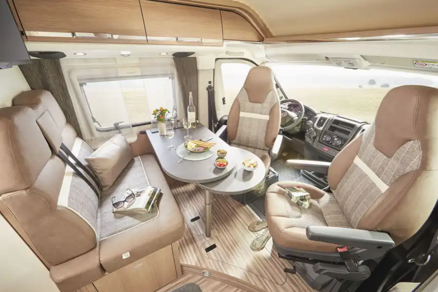 The lounge area in the Malibu Van Charming Coupe campervan (Click to view full screen)