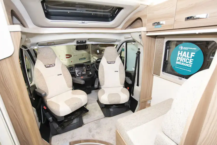 Cab seats facing the lounge in the Swift Escape Compact C502 motorhome (Click to view full screen)
