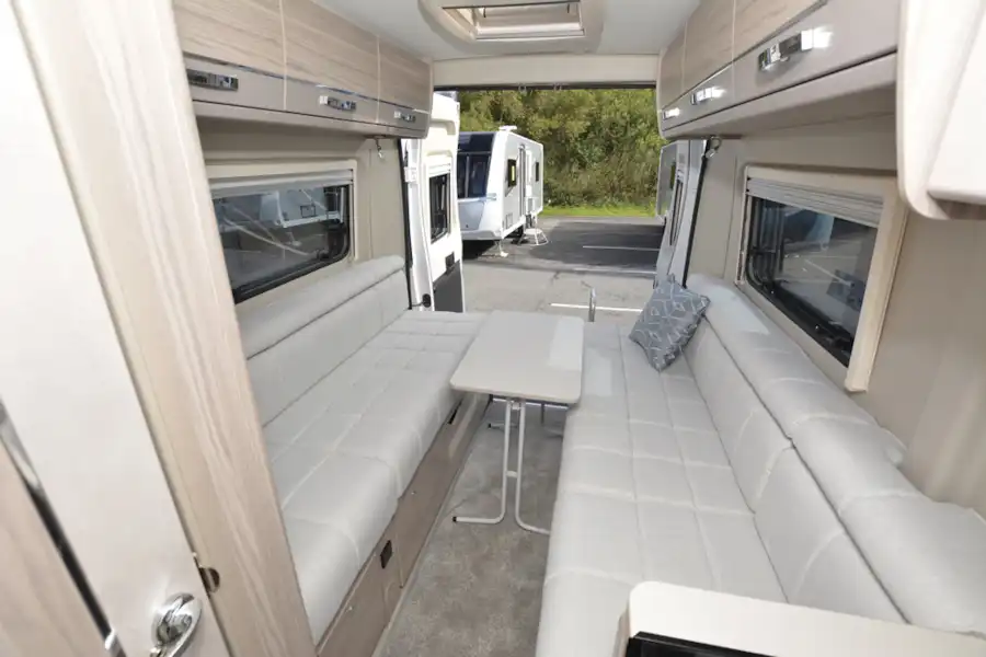 Side-facing sofa seating in the Elddis Autoquest CV20 campervan (Click to view full screen)