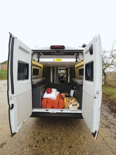 With rear doors open in the Adria Twin Supreme 640 SGX campervan (Click to view full screen)