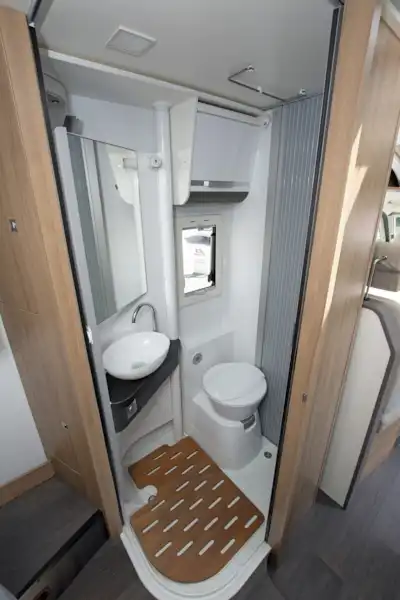 Wall moved aside to show the washroom in the Adria Matrix Axess 600 SC motorhome (Click to view full screen)