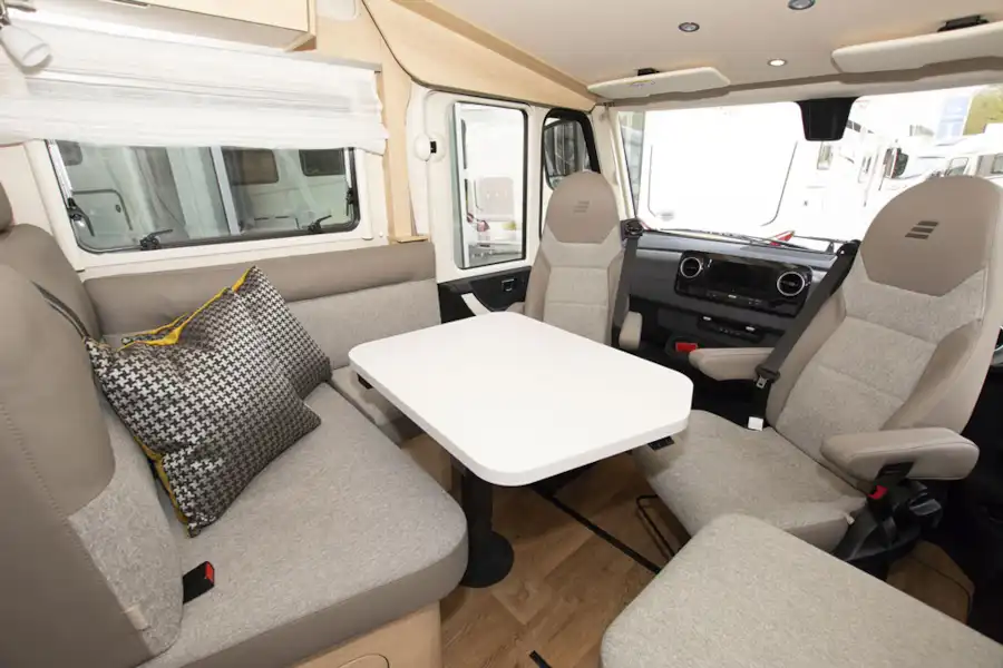 The lounge and cab area in the Hymer B-MC I 600 WhiteLine motorhome (Click to view full screen)