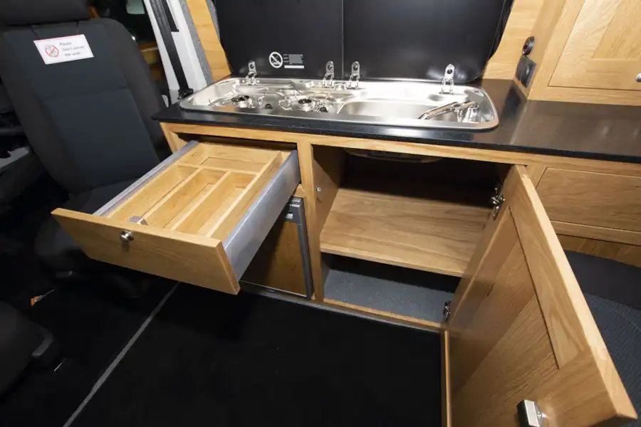 Drawers and kitchen storage in the Rolling Homes Columbus S campervan (Click to view full screen)