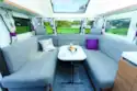 A wide lounge with U-shped seating and headrests!