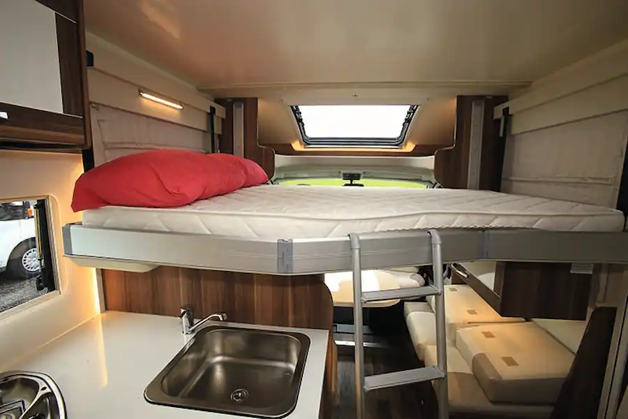 Even with the drop-down bed, the front dinette is well lit (Click to view full screen)