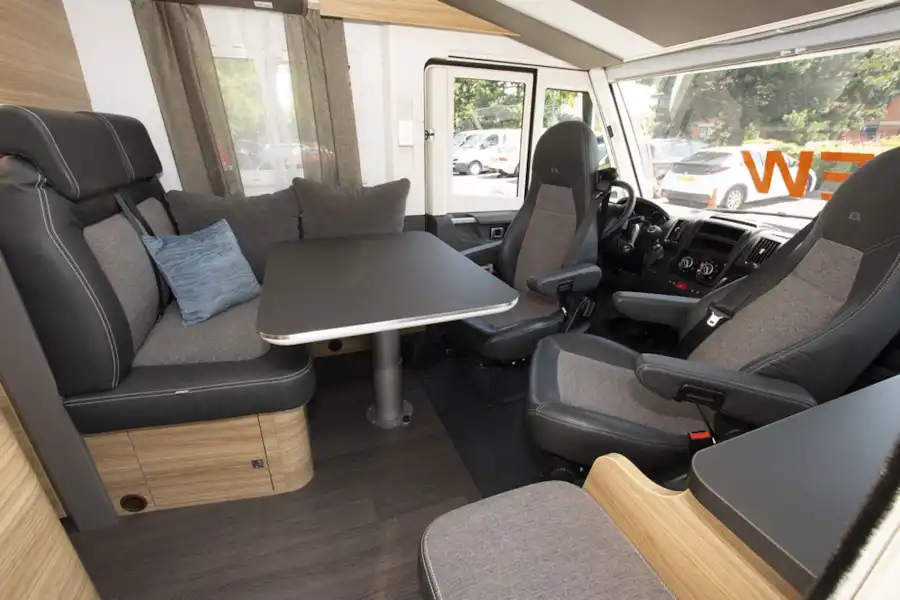 Cab seats facing the lounge in the Adria Sonic Axess 600 SL motorhome (Click to view full screen)