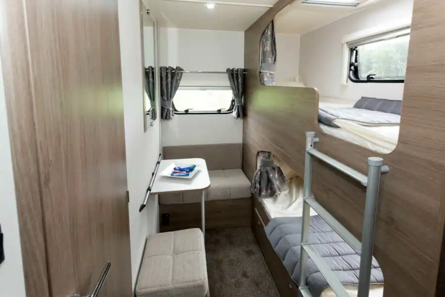 Two bunks in secluded pods and a little seating area (Click to view full screen)
