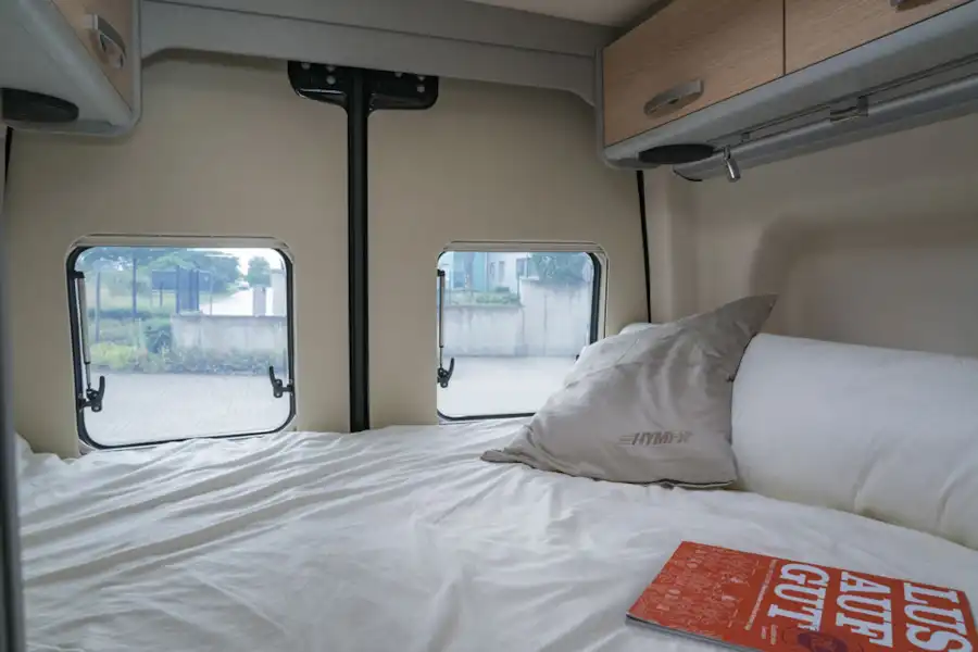 The transverse double bed in the rear of the Hymer Free S 600 campervan (Click to view full screen)