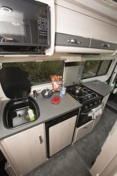 The kitchen in the Auto-Sleepers Fairford Plus campervan (Click to view full screen)