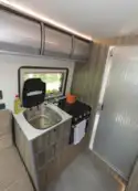 The practical kitchen in the The Axon Opportunity campervan 