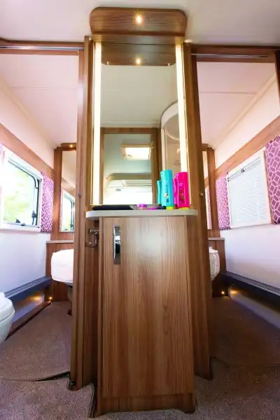 In the centre of the preening room, a dressing table with a backlit mirror (Click to view full screen)