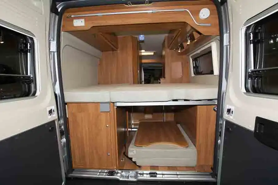 The rear of the motorhome, showing transverse bed and storage ©Warners Group Publications, 2019 (Click to view full screen)