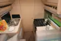 The kitchen is split across the aisle