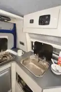 The cooker and sink lids can block the windows, but there is an extra light