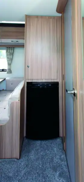 The wardrobe is above the fridge (Click to view full screen)